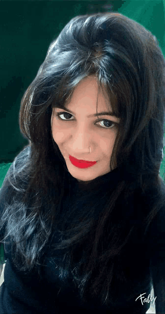 a woman wearing red lipstick and a nose ring has the word fally written on the bottom right
