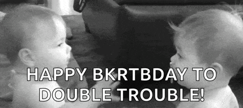 two babies are looking at each other and the words `` happy bkrtbday to double trouble ! ''