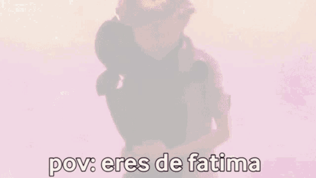 a man is hugging a black cat with the words `` pov : eres de fatima '' written below him .