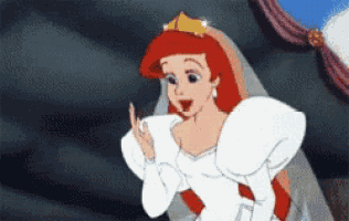 ariel from the little mermaid is wearing a wedding dress .