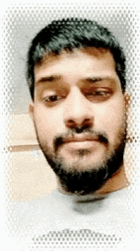 a man with a beard is looking at the camera with his eyes closed