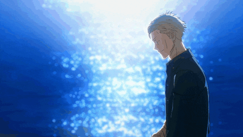 a man stands in front of a blue background