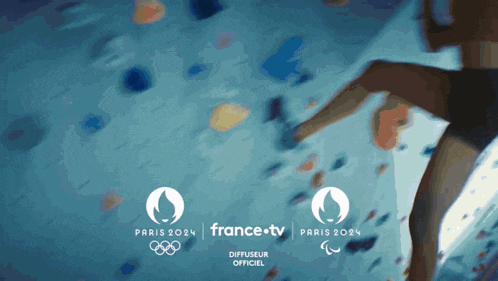 a poster for the paris 2024 olympics with a person climbing a wall