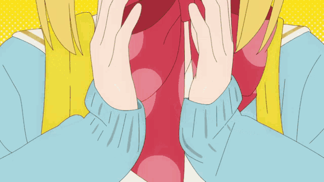 a girl wearing a blue sweater and a red bow tie