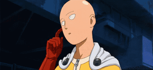 a bald man in a yellow jacket and red gloves is thinking .
