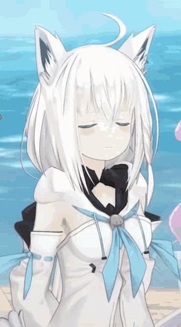 a cartoon character with white hair and ears is standing on a beach with her eyes closed