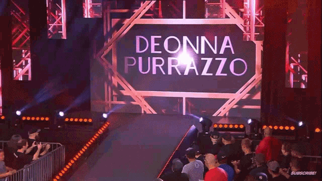 a crowd of people are watching a wrestling match between decina purazzo