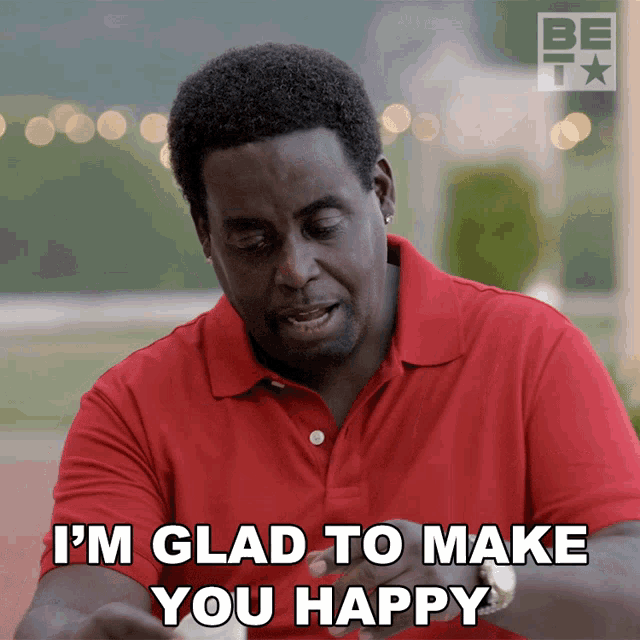 a man wearing a red shirt says i 'm glad to make you happy