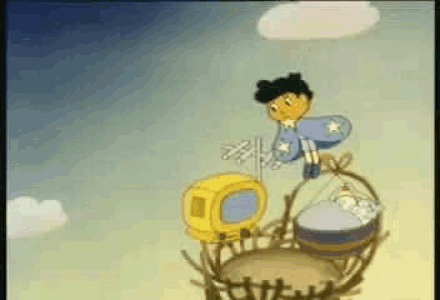 a cartoon character is sitting on top of a nest holding a baby .