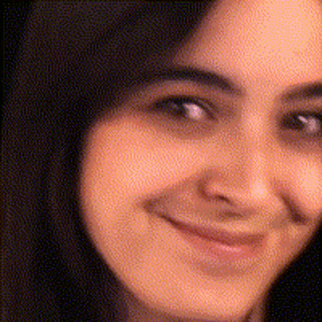 a close up of a woman 's face with polka dots on it