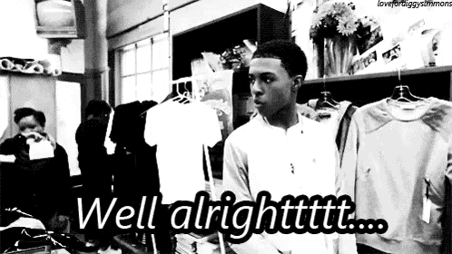 a black and white photo of a man in a clothing store with the words `` well alright ! ''