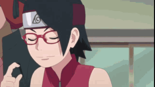 a girl wearing red glasses and a headband with the letter g on it