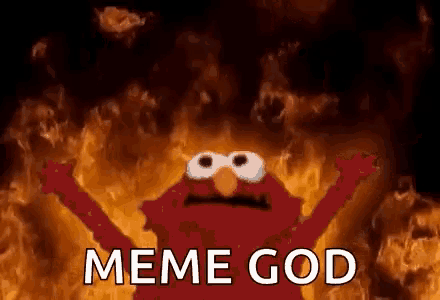 elmo from sesame street is standing in front of a fire with the words meme god written above him .