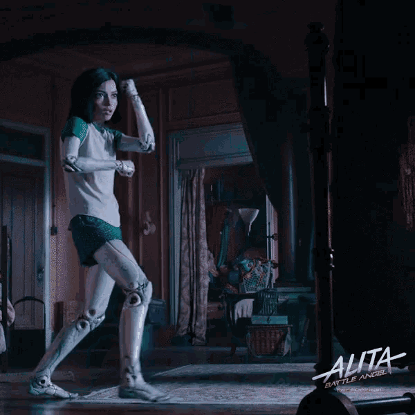 a movie poster for alita battle angel shows a woman in a white shirt