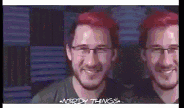 a man with red hair and glasses is smiling and says nerdy things at the bottom