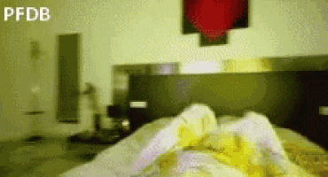 a blurry picture of a person laying on a bed with the words pfdb on the bottom
