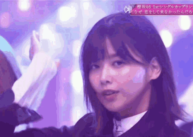 a close up of a woman 's face with the number 46 on the bottom right