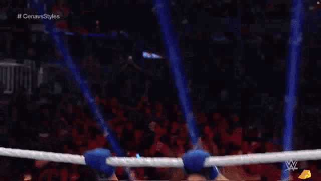 a man in a wrestling ring with a sign that says summer slam in the background