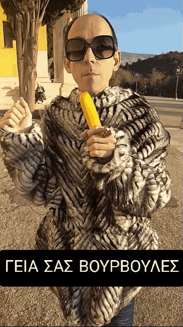 a man in a fur coat is holding a banana in his hand with a caption that says teia sas boyrboules