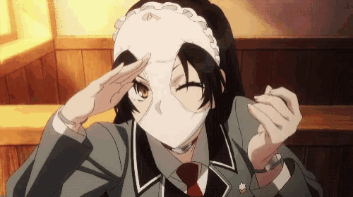 a girl wearing a mask with a maid headband on her head