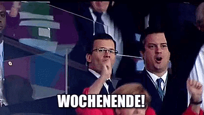 a group of people sitting in a stadium with the word wochenende written on the bottom
