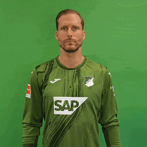 a man is wearing a green shirt with the word sap on it