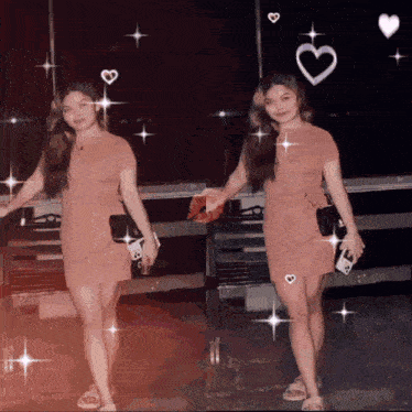 two women in pink dresses are standing next to each other with hearts around them