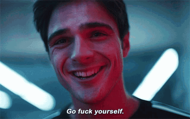a man is smiling and says " go fuck yourself "