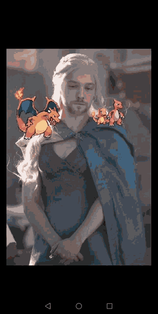 a man in a blue cape is surrounded by three pokemon