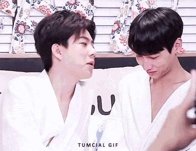 two men are looking at each other and the gif says tumcial gif on the bottom