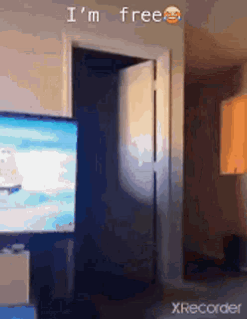 a room with a tv and the words i 'm free