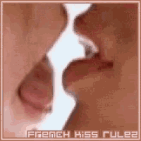 a close up of a couple kissing with the words french kiss ruler written above them