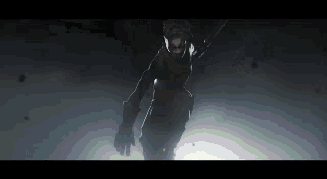 a person in a dark room with a sword in their hand
