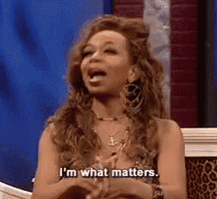 a woman is sitting in a chair with her mouth open and says `` i 'm what matters '' .