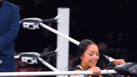 a woman in a wrestling ring with the word fox on the side