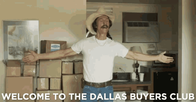 a man in a cowboy hat is standing in front of boxes and the words welcome to the dallas buyers club