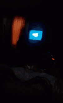a blue light is shining on a tv screen