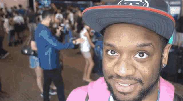 a man wearing a hat that says monkey on it