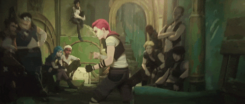 a group of people are gathered in a room including a woman with red hair