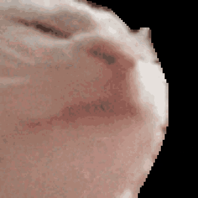 a close up of a person 's face with a pixelated background