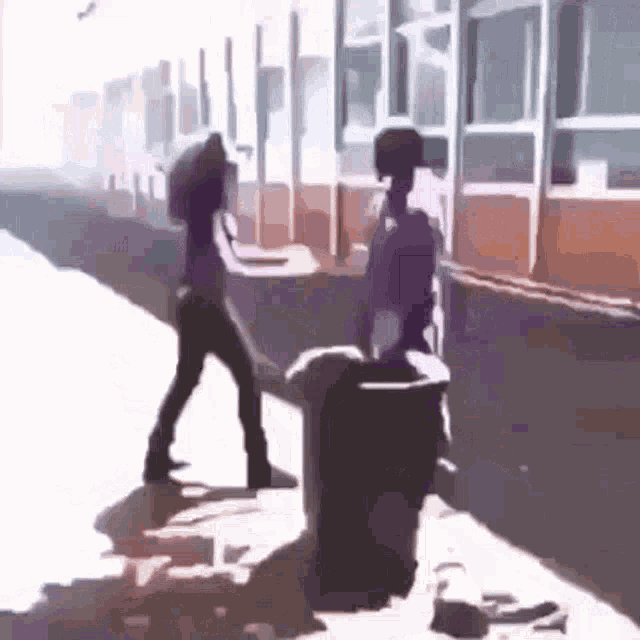 Kid Throws Garbage Bin At Girl Reversed GIF - Kid Throws Garbage Bin At Girl Reversed GIFs