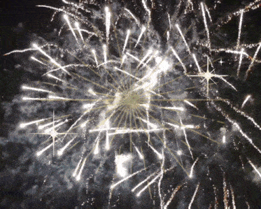 a fireworks display with a star in the center