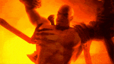 a man with a beard is holding a sword in a dark room