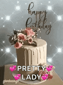 a birthday cake with flowers on top of it and the words `` happy birthday pretty lady '' written on it .