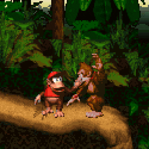 two monkeys are standing next to each other on a rock in a video game