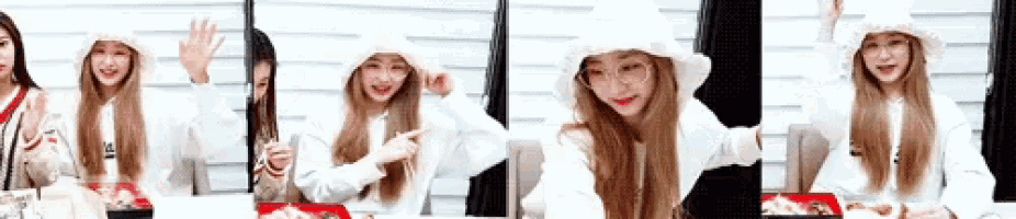 a girl wearing a white hat and glasses is sitting at a table with a box of food .