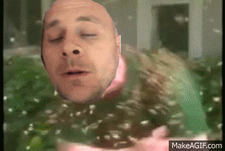 a bald man is swimming in a pool with his eyes closed and his mouth open .