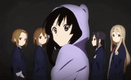 a group of anime girls are standing in a line with one wearing a purple hoodie