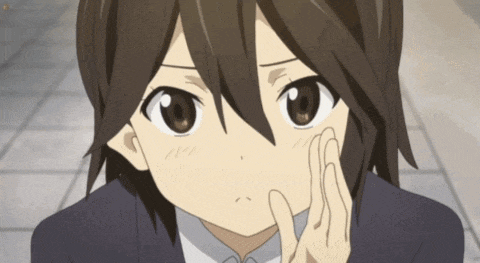 a close up of a person 's face with their hand on their face