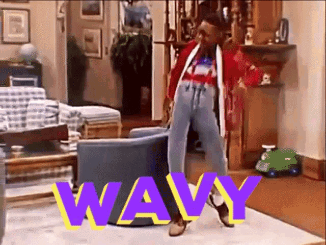 a woman is dancing in a living room with the word wavy written on the floor .